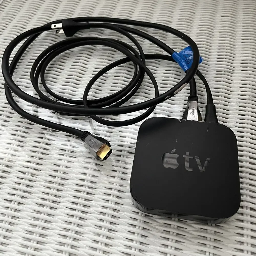 Apple TV 3rd generation HD media, model A1469, with power cable and HDMI cable